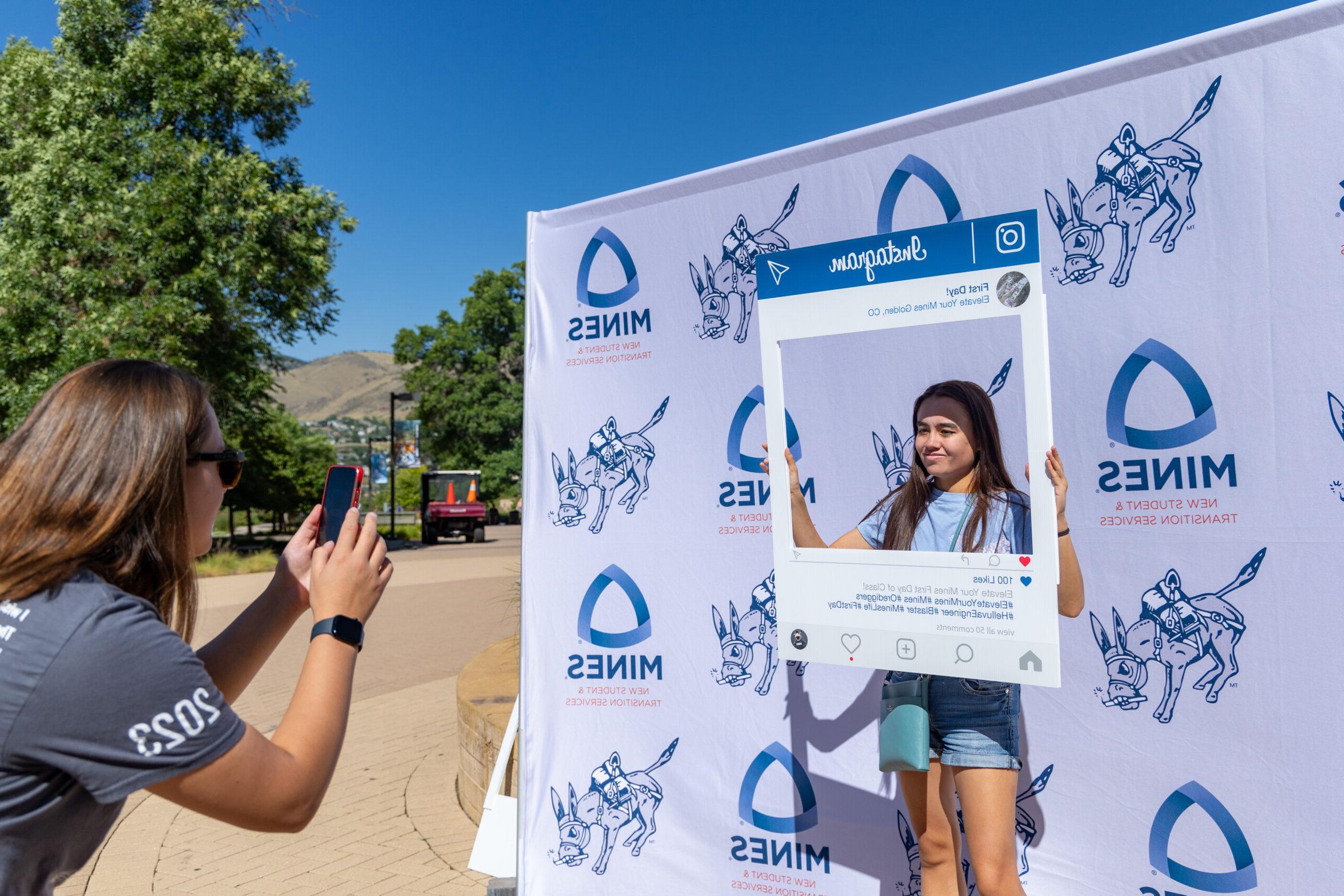 A student takes a photo on the first day of classes