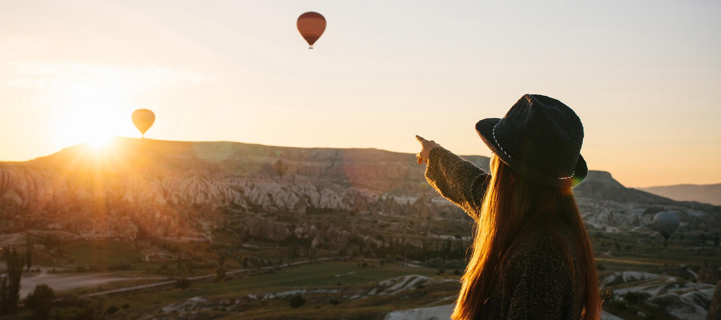 Girl pointing at the horizon